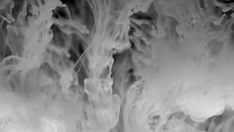 Intense-flow-of-white-smoke-over-pitch-black-background-fills-entire-frame