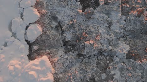 Drone-top-shot-of-land-surface-in-Anchorage-Alaska-with-cloudy-snowy-weather