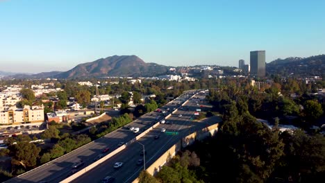 Tracking-drone-shot-of-Route-101-in-Studio-City,-California