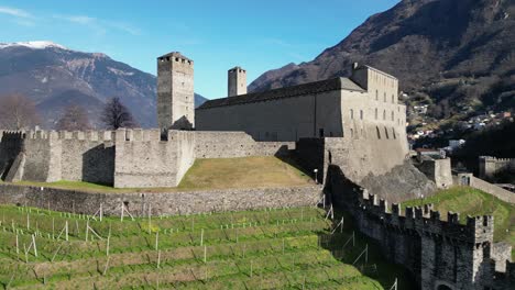 Bellinzona-Switzerland-hilltop-castle-and-blue-sky-rotating-reveal-of-the-walls