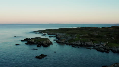 Experience-the-mesmerizing-beauty-of-Connemara,-Galway,-Ireland,-with-a-captivating-drone-push-shot-showcasing-the-lush-green-landscape-along-the-picturesque-coast