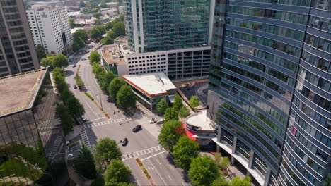 Cars-on-junction-between-modern-skyscraper-towers-in-Atlanta-City,-USA