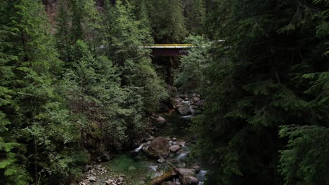 Truck-driving-over-bridge-in-forest-ready-to-adventure