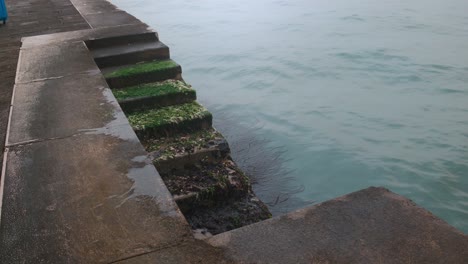 Mossy-Venetian-Steps-into-Calm-Water