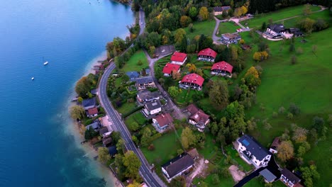 Peaceful-aerial-view-of-a-small-town-nestled-on-the-shores-of-a-sparkling-lake