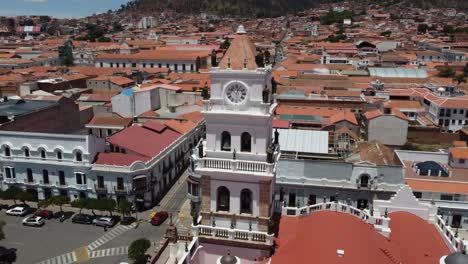Aerial-closely-orbits-clock-tower-statues-on-Sucre-Basilica-in-Bolivia