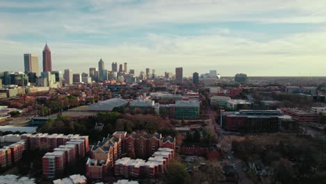 Northern-periphery-of-Atlanta,-Georgia,-USA,-residential-buildings-punctuate-the-scenery-as-the-city's-skyline-adorns-the-horizon