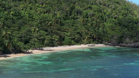Telephoto-aerial-of-hidden-sand-beach-in-remote-countryside-Dominican-Republic