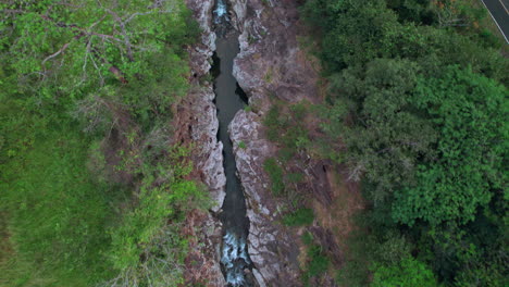 Cajones-de-chame-river-flowing-through-lush-panamanian-jungle,-aerial-view