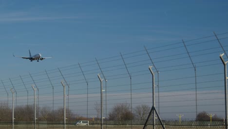 Airplane-Approach-For-Landing-In-Slow-Motion-Against-Blue-Sky