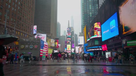 Vibrant-LED-screens-illuminate-a-wet-and-rainy-Times-Square-for-Manhattan-pedestrians