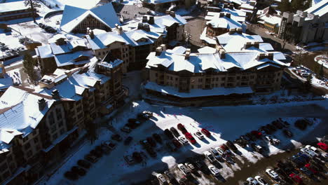 Palisades,-Lake-Tahoe-CA-USA,-Aerial-View-of-Ski-Resort-Buildings-and-Ski-Tracks-on-Sunny-Winter-Day