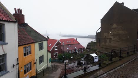 People-walking-along-the-quite-streets-of-Whitby-a-sleepy-fishing-village-on-the-Yorkshire-coast-of-England