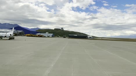 Passenger-POV-from-airplane-taxiing-on-tarmac-approaching-gate-at-Ushuaia-Malvinas-International-airport