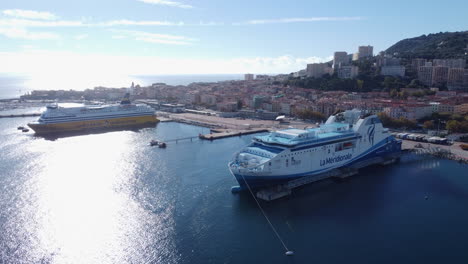 Ferry-ships-anchored-in-port-of-Ajaccio-on-sunny-day,-Corsica