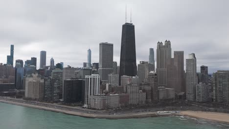 Drone-shot-of-tall-buildings-on-the-shores-of-Lake-Michigan,-United-States