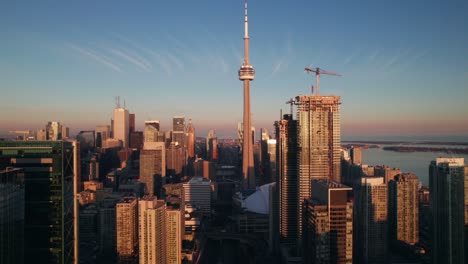 Gorgeous-aerial-of-Toronto's-CN-Tower-in-evening-lighting,-4K
