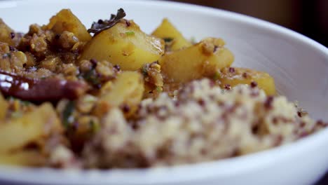 Nice-close-up-shot-of-papaya-curry-rotating-in-a-white-bowl-full-of-flavor-and-spiciness