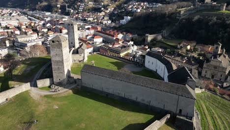 Bellinzona-Switzerland-castle-pullback-flight-to-reveal-the-ruins-and-village