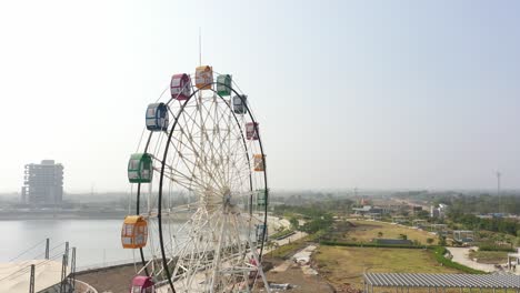 rajkot-atal-lake-drone-view-Drone-camera-is-moving-towards-the-side-where-a-big-giant-wheel-is-visible-and-a-big-walking-street-is-also-visible-behind-it