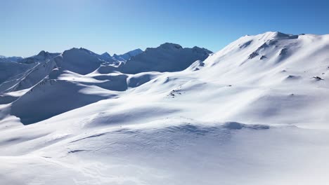 a-beautiful-white-winter-landscape-with-big-mountains-and-a-blue-sky