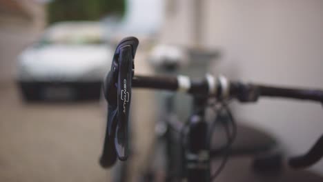 Closeup-shot-of-handle-of-mountain-bike-with-blurred-background