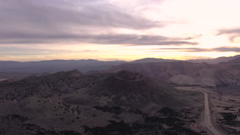 Sunset-drone-flight-around-Santa-Clara-Volcano-in-Utah,-USA