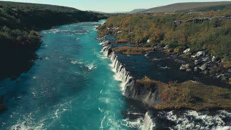 Incredibly-gorgeous-drone-aerial-of-green-pools-and-waterfalls-against-the-river-landscape