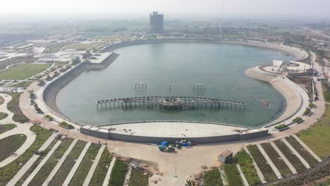 rajkot-atal-lake-drone-view-drone-camera-moving-forward-where-a-big-lake-and-lots-of-birds-are-also-visible-and-the-water-is-glistening-with-sun-rays