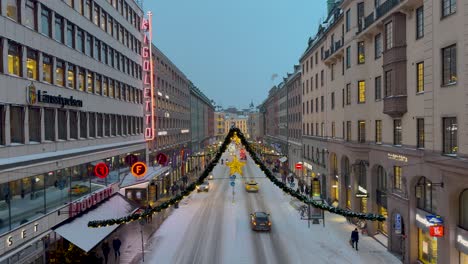 Twilight-view-of-Kungsgatan-adorned-with-Christmas-lights,-Stockholm