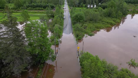 Flooded-road-closed-due-to-bridge-overflowing-with-river-water-post-tropical-storm