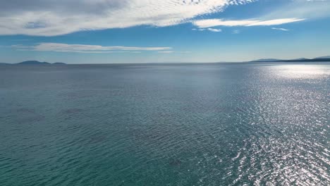 Drone-footage-over-the-sea-and-sky-with-clouds