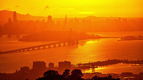 Golden-sunset-timelapse-of-Bay-bridge-between-Oakland-and-San-Francisco,-tele