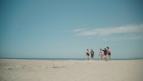 Ladies-Walking-Toward-Camera-on-a-Beach-at-La-Union,-Philippines