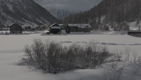 Stunning-Livigno-Alps-drone-video:-snow-peaks,-city-and-mountain-town,-ideal-for-high-quality-winter-and-tourism-ads