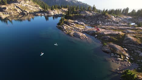 Mountaintop-paddleboarding-on-calm-lake