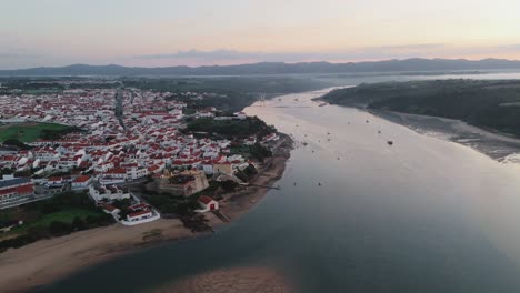 Aerial-View-Of-Lisbon-Town-By-The-Riverbanks-In-Portugal