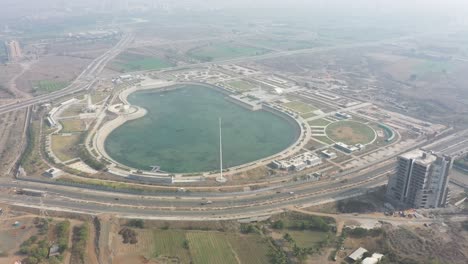 Rajkot-Atal-lake-drone-view-Many-different-ashok-chakra-and-lake-and-garden-view-from-many-different-places,-Rajkot-New-Race-Course,-Atal-Sarovar