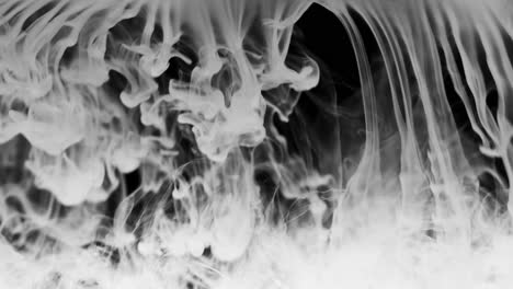 Bright-white-thic-smoke-falls-across-the-frame,-makes-abstract-curly-shapes,-gathers-at-the-bottom,-dissolves-into-haze
