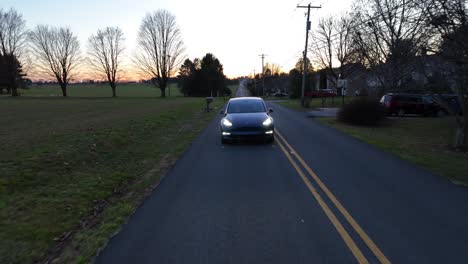 Tesla-driving-on-suburban-American-street