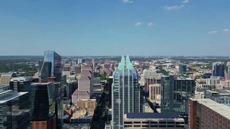 Aerial-Reverse-reveal-from-Frost-Bank-Tower-towards-the-river-in-Austin-Texas