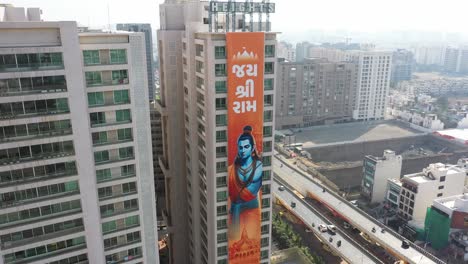 Rajkot-aerial-drone-view-There-are-many-buildings-below-and-above-and-the-banner-of-Jai-Shri-Ram-is-visible-on-the-big-building-of-Rajkot