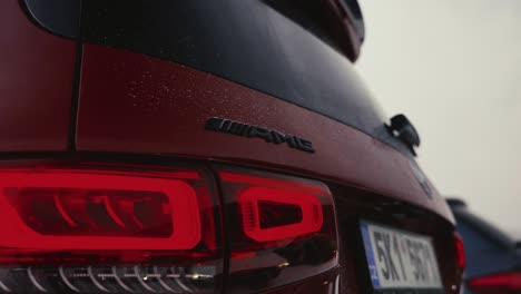 Mercedes-car-rear-AMG-logo-and-tail-lights-during-outdoor-motor-show