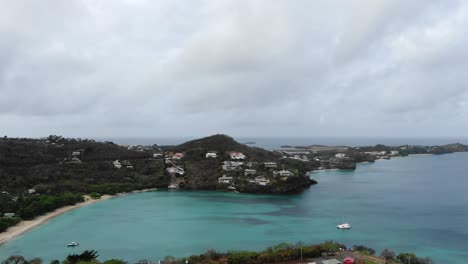 Overcast-day-view-of-Mourne-Rouge-Beach-in-Grenada-with-calm-turquoise-waters