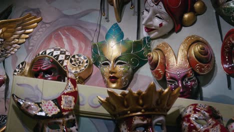 Eclectic-mix-of-dramatic-Venetian-masks,-Ca'-Macana,-Italy