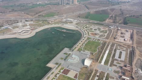 Rajkot-Atal-lake-drone-view-don-camera-is-moving-forward-there-are-many-big-gardens-and-many-different-types-of-buildings-are-being-built-around
