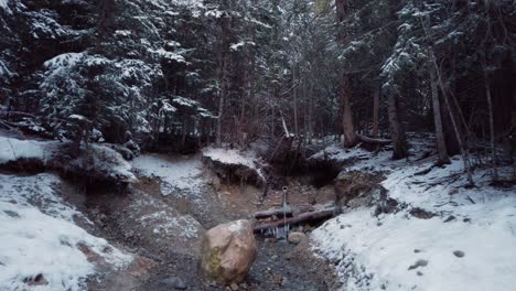 Fresh-water-well-spring-in-the-forest-in-winter-approached