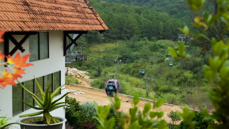 Gondolas-Arriving-and-Departing-From-Da-Lat-Cable-Car-Station-Near-Truc-Lam-Monastery