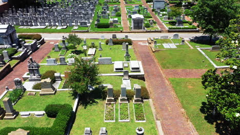Forwards-fly-over-graves-in-green-lawn