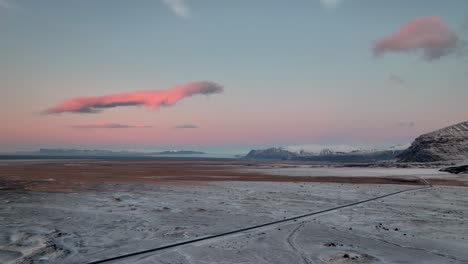 Pink-Sunrise-Over-Snowy-Landscape-In-Winter-In-Oraefi,-South-Iceland
